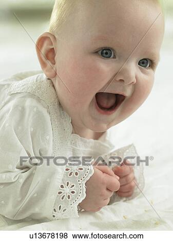Baby looking excited and happy View Large Photo Image Stock Photo - Baby looking excited and happy. Fotosearch