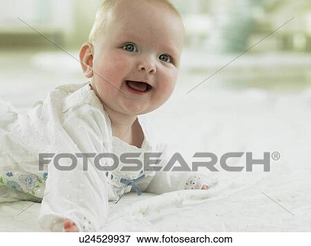 Stock Photo - Baby looking excited and happy. Fotosearch