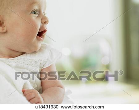 Stock Image - Baby looking excited. Fotosearch