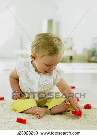 Baby playing with plastic letters View Large Photo Image Stock Image - Baby playing with plastic letters. Fotosearch
