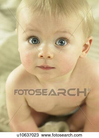 Baby sitting looking up at camera View Large Photo Image Stock Image - Baby sitting looking up at camera. Fotosearch