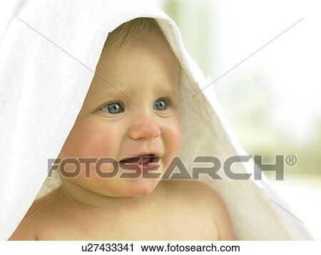 Baby sitting with a towel over head View Large Photo Image Stock Image - Baby sitting with a towel over head. Fotosearch