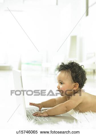 Baby with a laptop View Large Photo Image Stock Photography - Baby with a laptop. Fotosearch