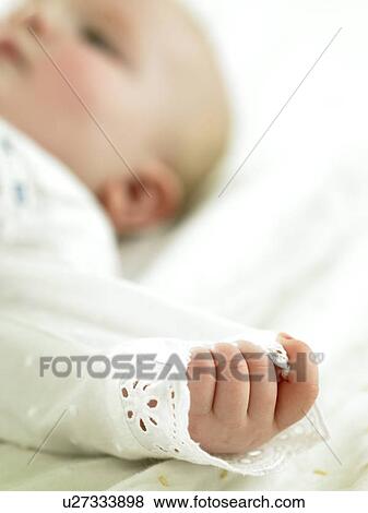 Baby with focus on hand View Large Photo Image Stock Photo - Baby with focus on hand. Fotosearch