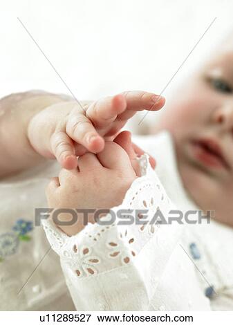 Baby with focus on hands View Large Photo Image Stock Photo - Baby with focus on hands. Fotosearch