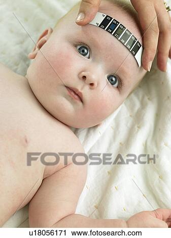Baby with woman taking temperature View Large Photo Image Stock Image - Baby with woman taking temperature. Fotosearch