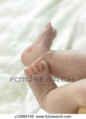 Stock Photo - Baby's bare feet. Fotosearch