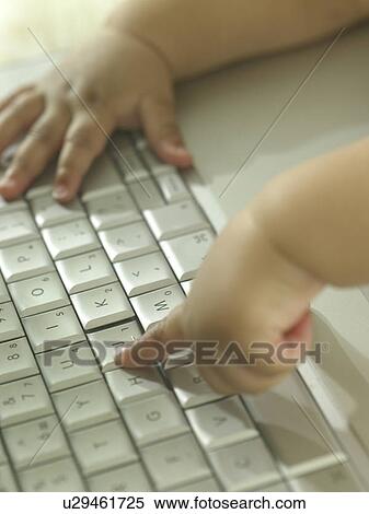 Baby's hands at a computer keyboard View Large Photo Image Stock Photography - Baby's hands at a computer keyboard. Fotosearch