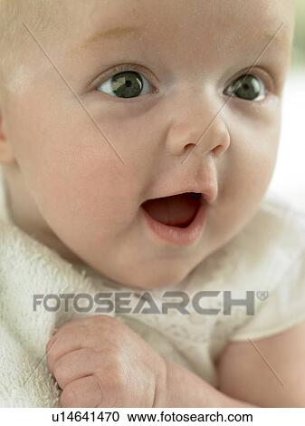 baby holding towel