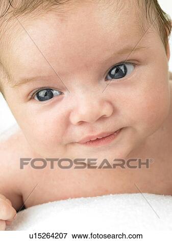 baby holding towel