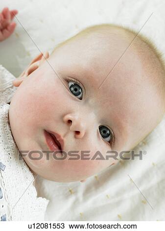 Baby laying down View Large Photo Image Stock Image - Baby laying down. Fotosearch