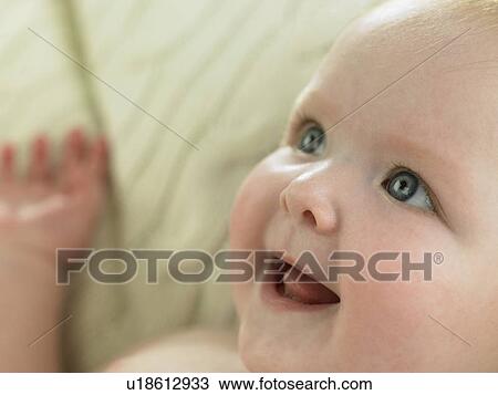 Baby looking upward and smiling View Large Photo Image Stock Image - Baby looking upward and smiling. Fotosearch