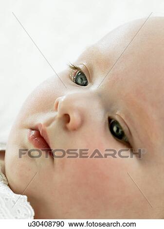 Baby lying down View Large Photo Image Stock Image - Baby lying down. Fotosearch