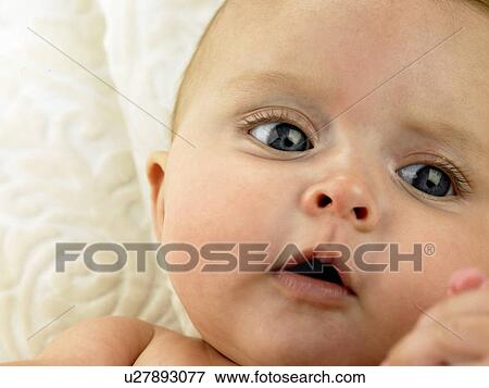 Baby lying down View Large Photo Image Stock Photo - Baby lying down. Fotosearch