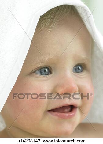 Baby with towel over head View Large Photo Image Stock Photo - Baby with towel over head. Fotosearch