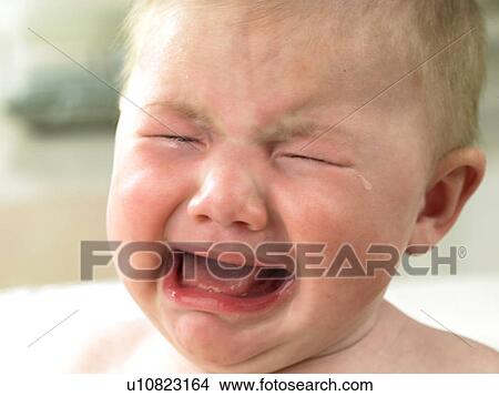 Baby's face close up crying View Large Photo Image Picture - Baby's face close up crying. Fotosearch