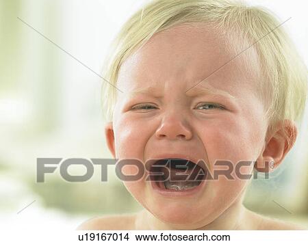 Baby's face close up crying View Large Photo Image Picture - Baby's face close up crying. Fotosearch