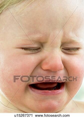 Baby's face close up crying View Large Photo Image Stock Image - Baby's face close up crying. Fotosearch