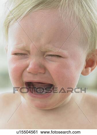 Baby's face close up crying View Large Photo Image Stock Image - Baby's face close up crying. Fotosearch