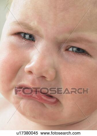 Baby's face close up crying View Large Photo Image Stock Photography - Baby's face close up crying. Fotosearch