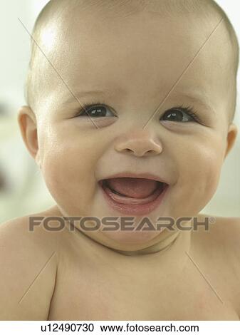 Baby's face close up laughing View Large Photo Image Stock Image - Baby's face close up laughing. Fotosearch