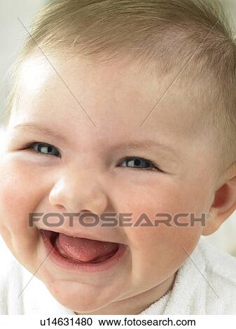 Stock Image - Baby's face close up laughing. Fotosearch