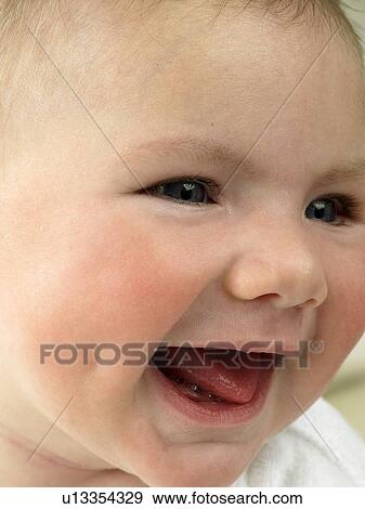 Baby's face close up laughing View Large Photo Image Stock Photo - Baby's face close up laughing. Fotosearch
