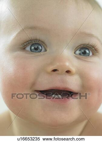 Baby's face close up smiling View Large Photo Image Stock Photography - Baby's face close up smiling. Fotosearch