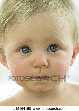 Stock Image - Baby's face close up. Fotosearch