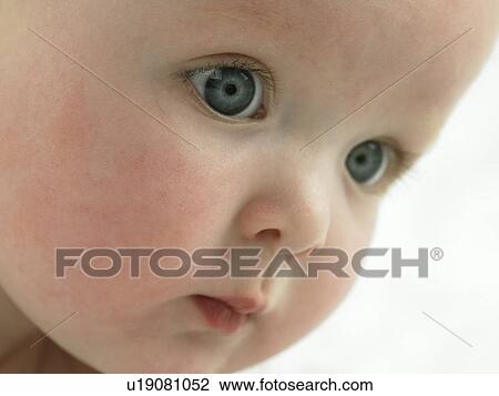 Stock Image - Baby's face close up. Fotosearch