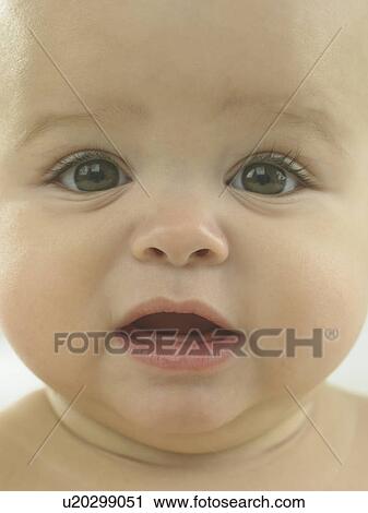 Stock Image - Baby's face close up. Fotosearch