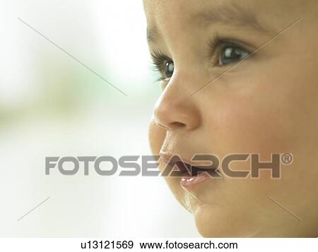 Baby's face close up View Large Photo Image Stock Photo - Baby's face close up. Fotosearch