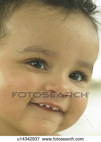 Baby's face close up View Large Photo Image Stock Photo - Baby's face close up. Fotosearch