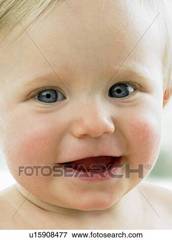 Baby's face close up View Large Photo Image Stock Photo - Baby's face close up. Fotosearch