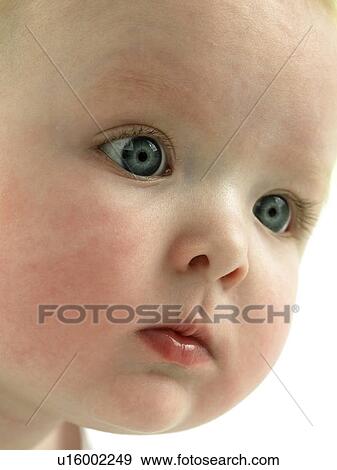 Baby's face close up View Large Photo Image Stock Photo - Baby's face close up. Fotosearch