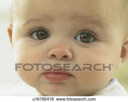 Baby's face close up View Large Photo Image Stock Photo - Baby's face close up. Fotosearch