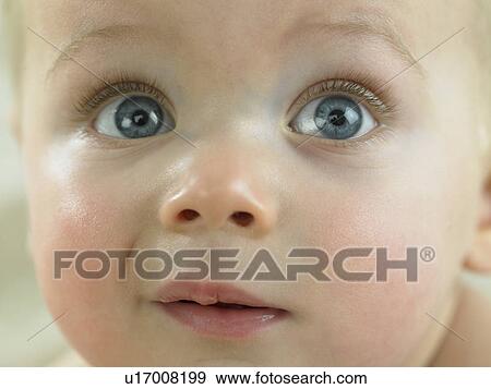 Baby's face close up View Large Photo Image Stock Photo - Baby's face close up. Fotosearch