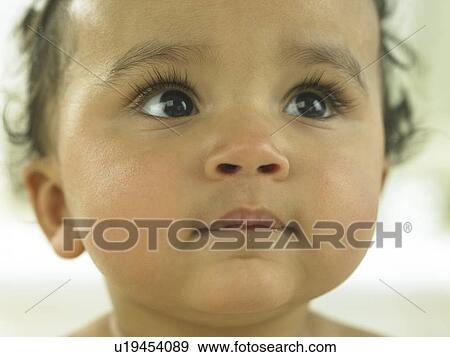 Baby's face close up View Large Photo Image Stock Photo - Baby's face close up. Fotosearch