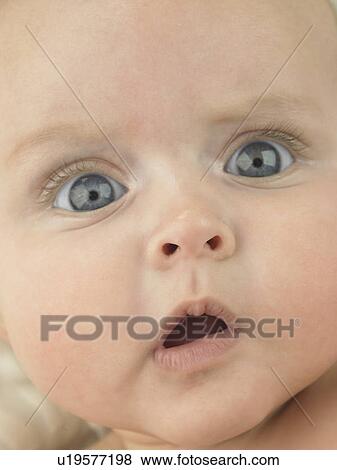 Baby's face close up View Large Photo Image Stock Photo - Baby's face close up. Fotosearch