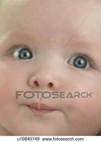 Baby's face close up View Large Photo Image Stock Photo - Baby's face close up. Fotosearch