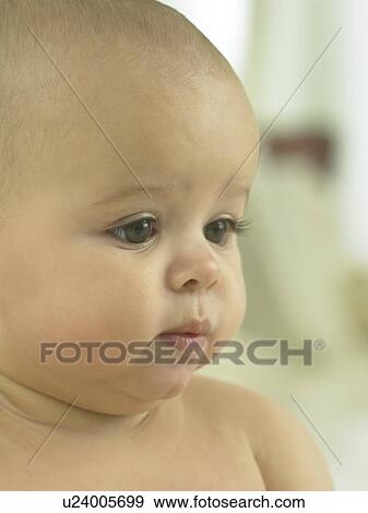 Baby's face close up View Large Photo Image Stock Photo - Baby's face close up. Fotosearch