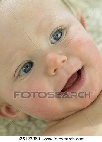 Baby's face close up View Large Photo Image Stock Photo - Baby's face close up. Fotosearch
