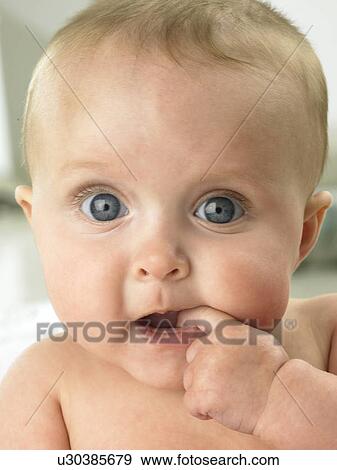 Baby's face close up View Large Photo Image Stock Photo - Baby's face close up. Fotosearch