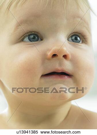 Stock Photography - Baby's face close up. Fotosearch