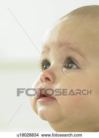Sad baby's face close up View Large Photo Image Picture - Sad baby's face close up. Fotosearch
