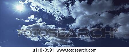 Blue skies with clouds View Large Photo Image Stock Image - Blue skies with clouds. Fotosearch