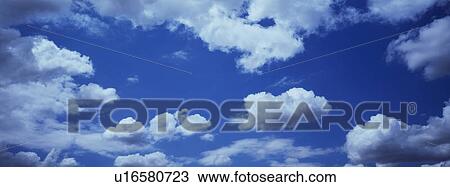 Blue skies with clouds View Large Photo Image Stock Image - Blue skies with clouds. Fotosearch