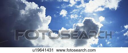 Blue skies with clouds View Large Photo Image Stock Image - Blue skies with clouds. Fotosearch