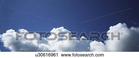 Blue skies with clouds View Large Photo Image Stock Image - Blue skies with clouds. Fotosearch