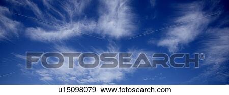 Blue skies with clouds View Large Photo Image Stock Photo - Blue skies with clouds. Fotosearch